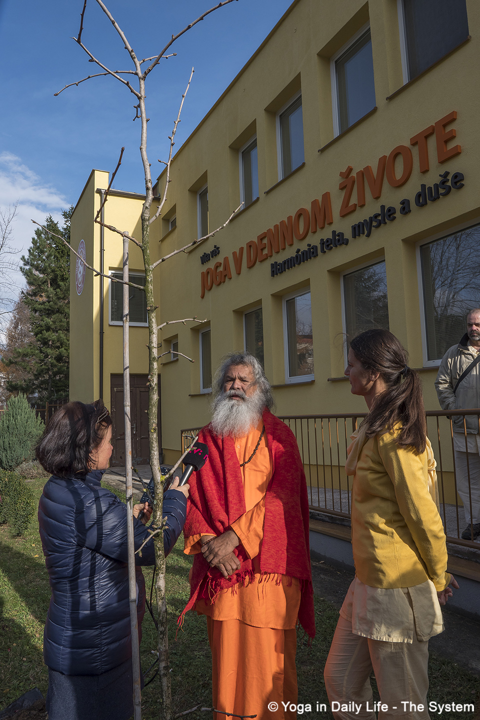 interview in front of the ashram and peace tree